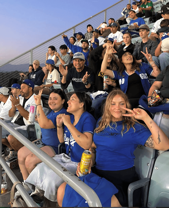 Teams group photo on a soccer field at golden hour